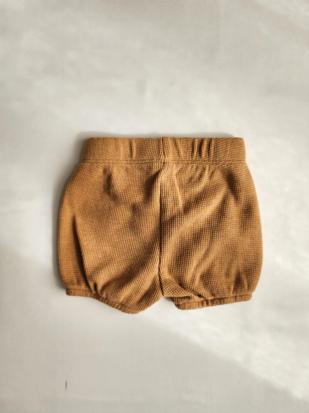 Short bébé Disney camel – 0-3 mois – en très bon état