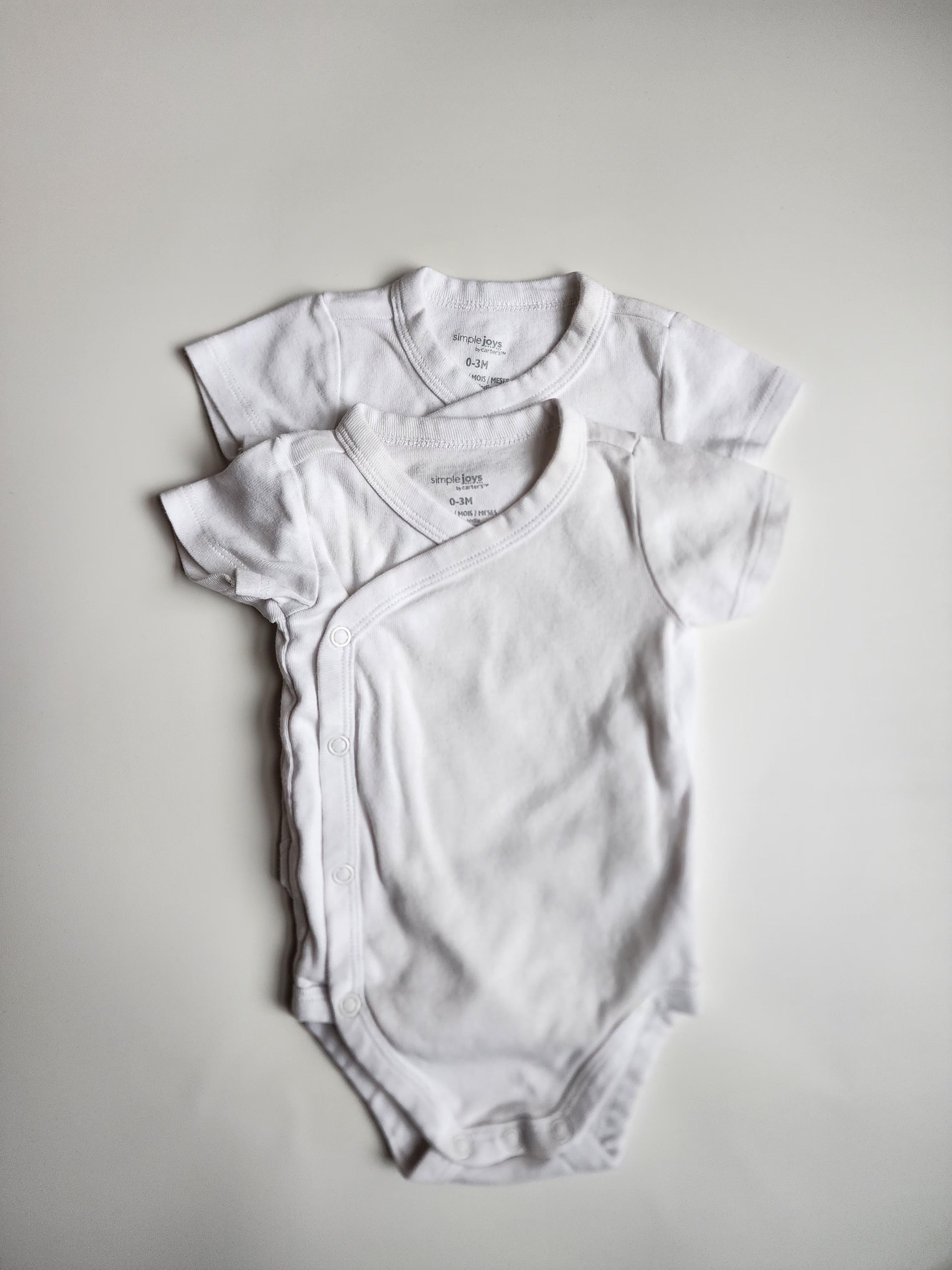 Lot de 2 bodies manches courtes Georges – 0-3 mois – Très bon état