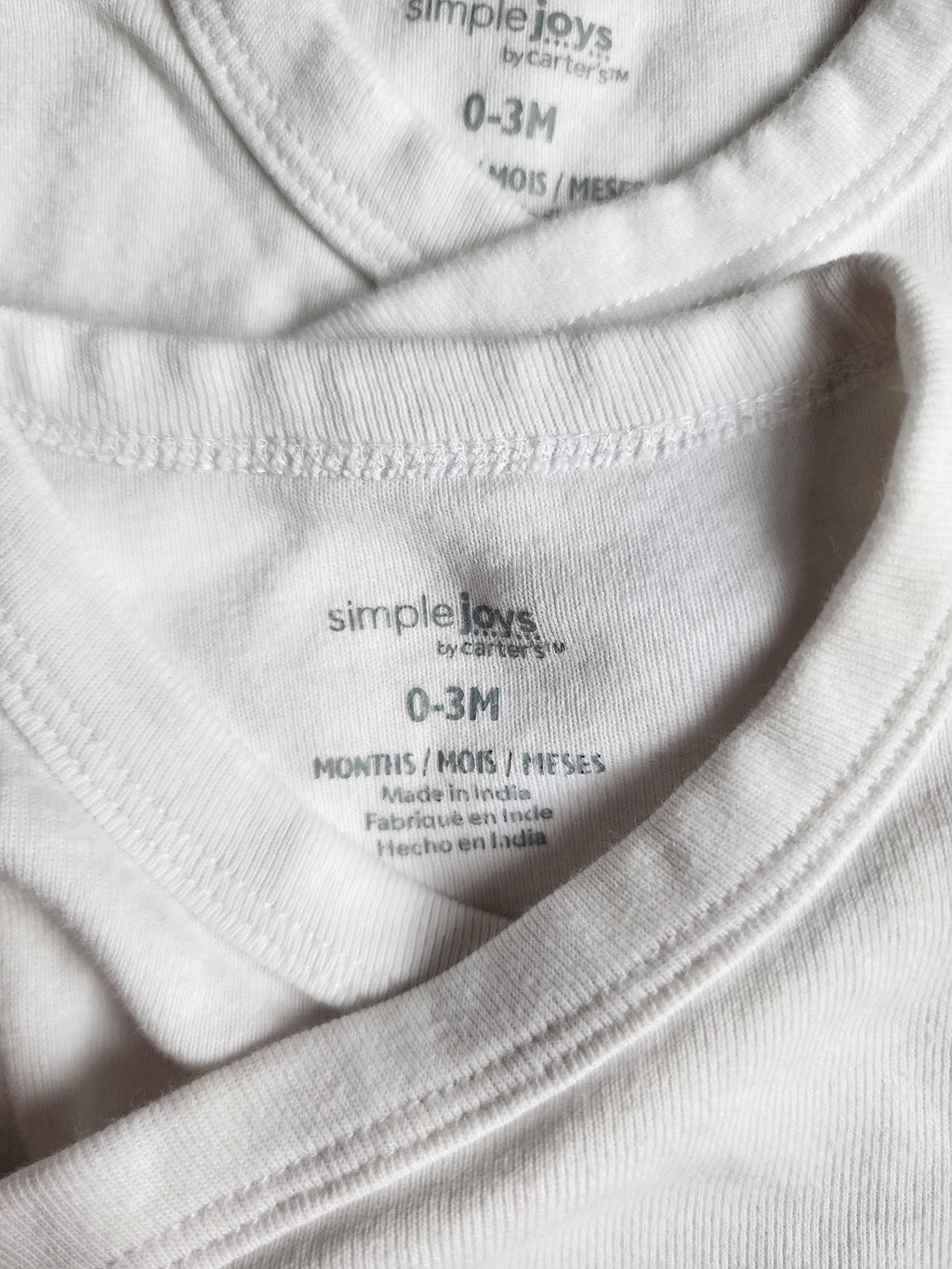 Lot de 2 bodies manches courtes Georges – 0-3 mois – Très bon état